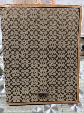 Coach Signature Portfolio in Brown and Tan.